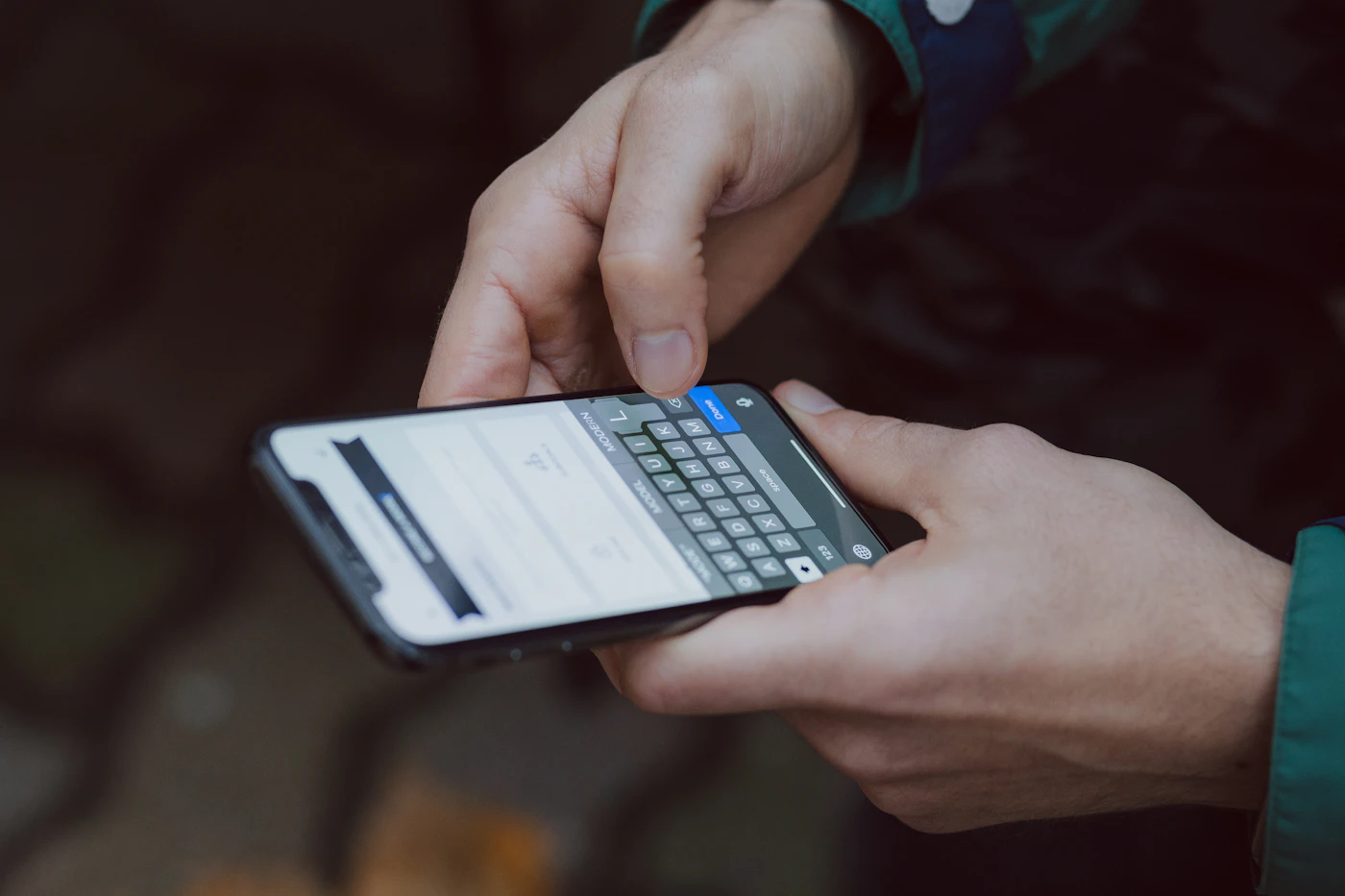 Person typing a text message on a smartphone